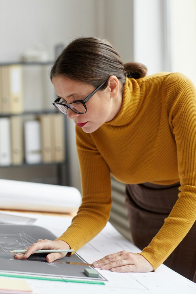 Female Engineer Inspecting Plans